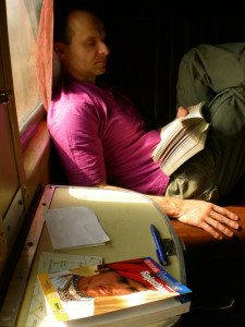 Tomasz Chrusciel Reading a book on the train form Khajuraho to Agra, India